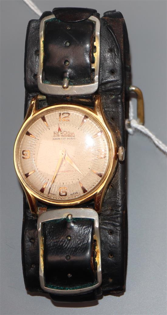 A gentlemans 1950s? 18k yellow metal Herodia manual wind wrist watch, on associated leather strap.